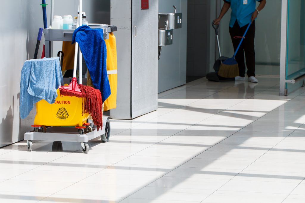 janitorial cart in hallway of office building 