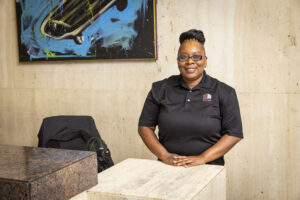 Desk security guard smiling at camera