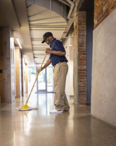 Man mopping office floor