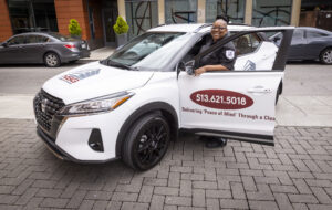 Security guard standing by company car