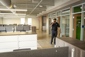 security guard completing tour in office